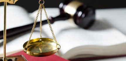 Criminal law gavel and gold scale