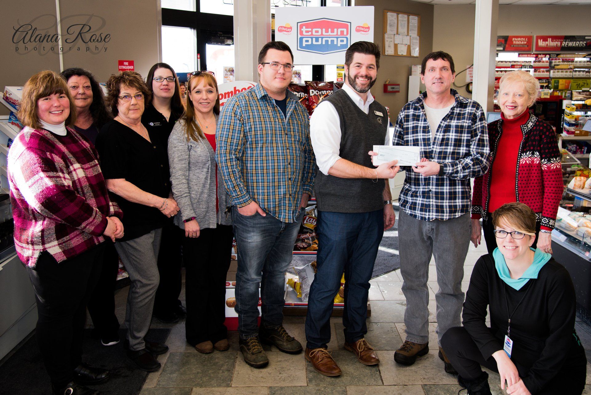 Town Pump employees presenting check from Town Pump Charitable Foundation to God's Love Shelter