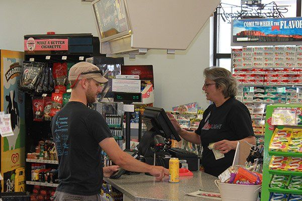 Town Pump in Red Lodge interior - employee processing transaction for a customer