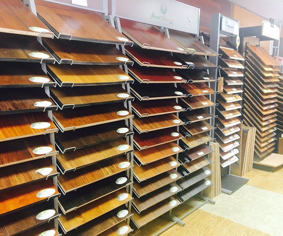 A display of different types of wood flooring in a store