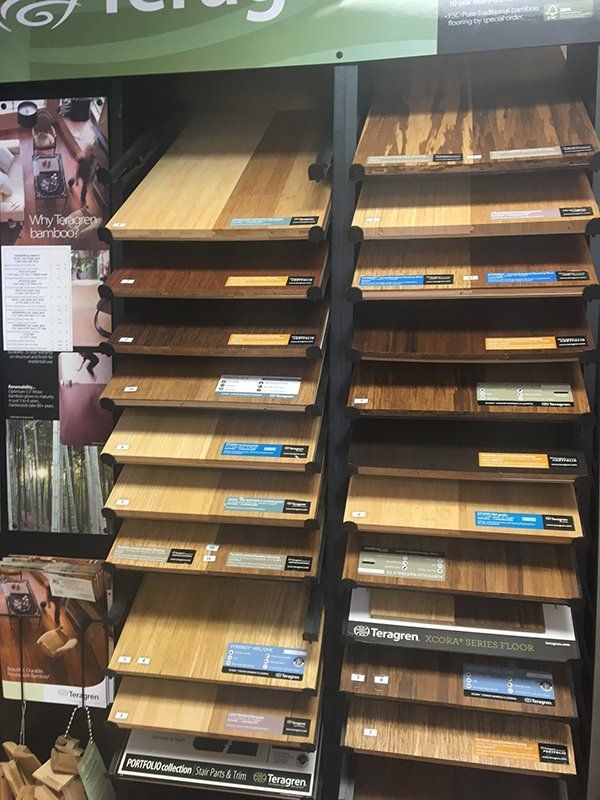 A display of different types of wood flooring in a store