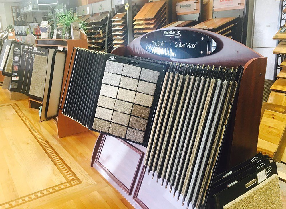 A display of carpets and tiles in a store