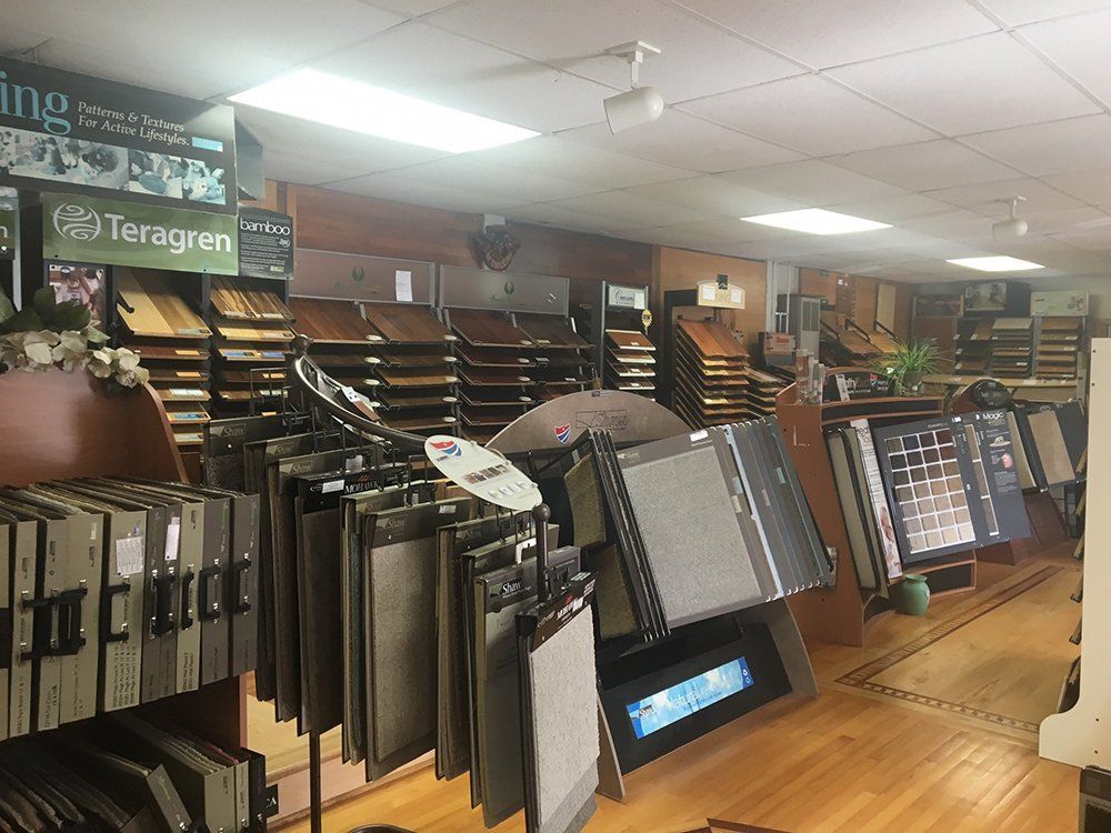 A store filled with lots of carpets and tiles.