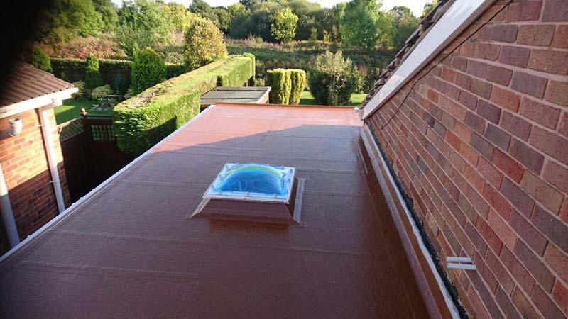 Velux window installation on a flat roof