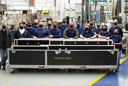 Comtek Floors Team poses with final CRJ delivery of floor panels