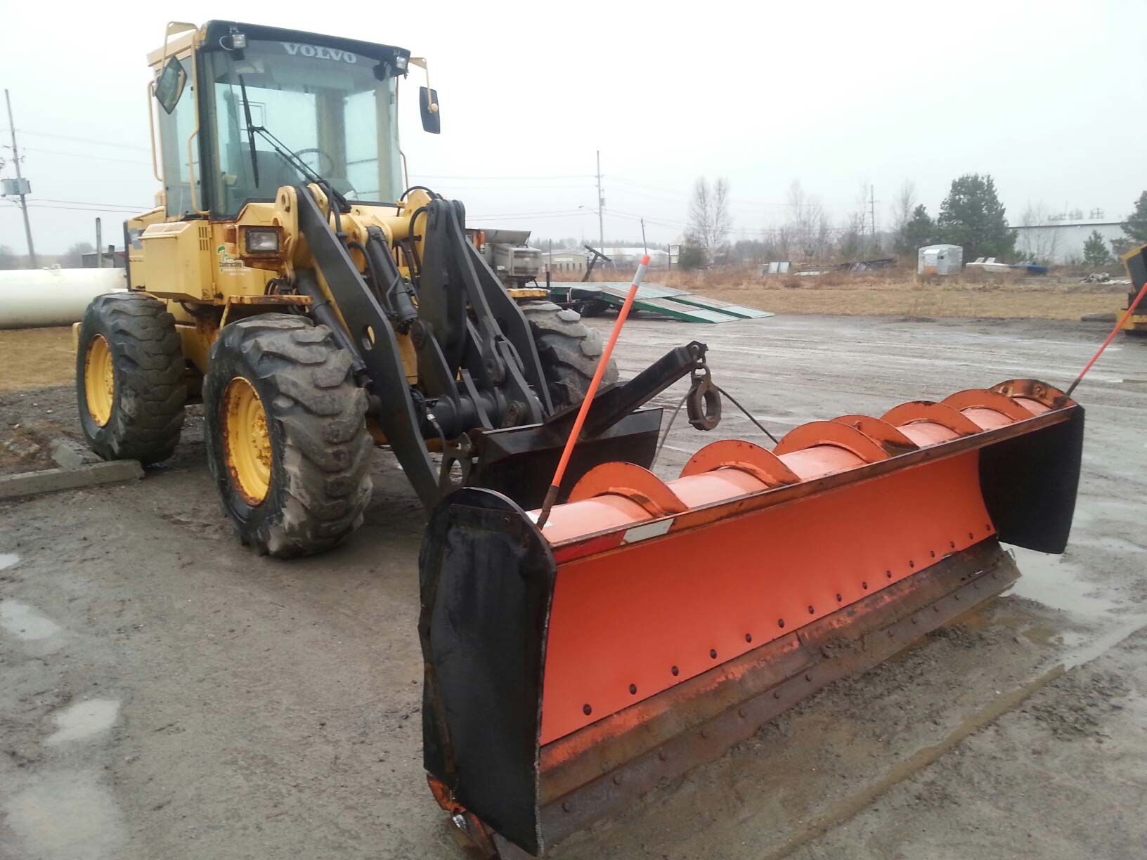 front-end loader with snow removal attachment