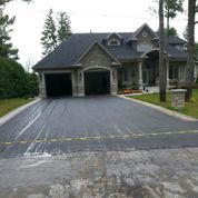 House with new paved driveway