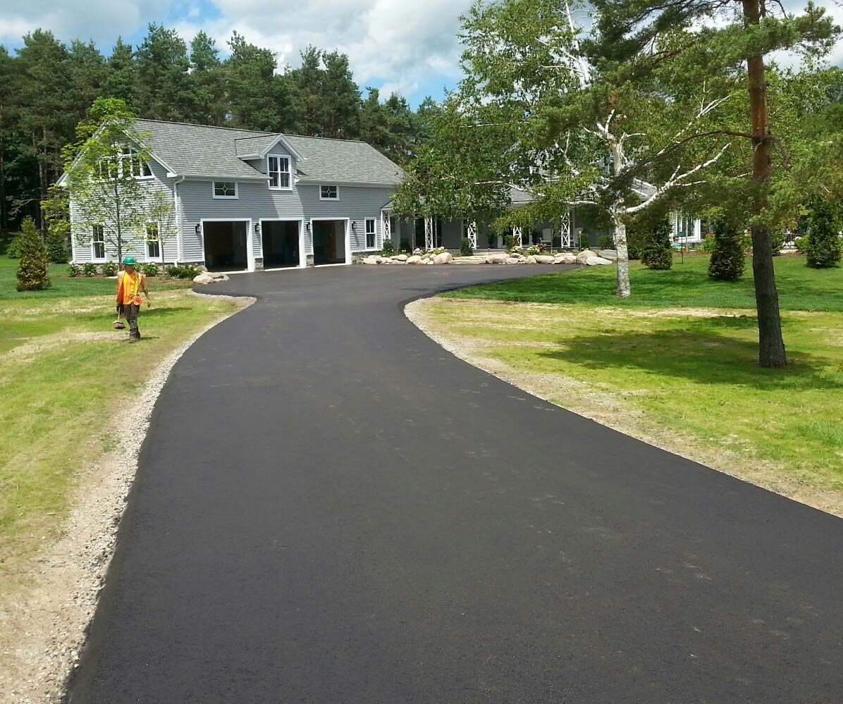 house with paved driveway