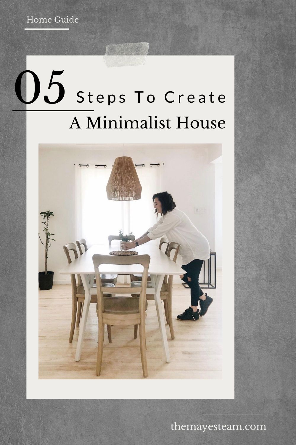 Debbie Mayes sets a candle on the table in her minimalist home. Image overlaid with text that reads 05 Steps to Create a Minimalist Home.