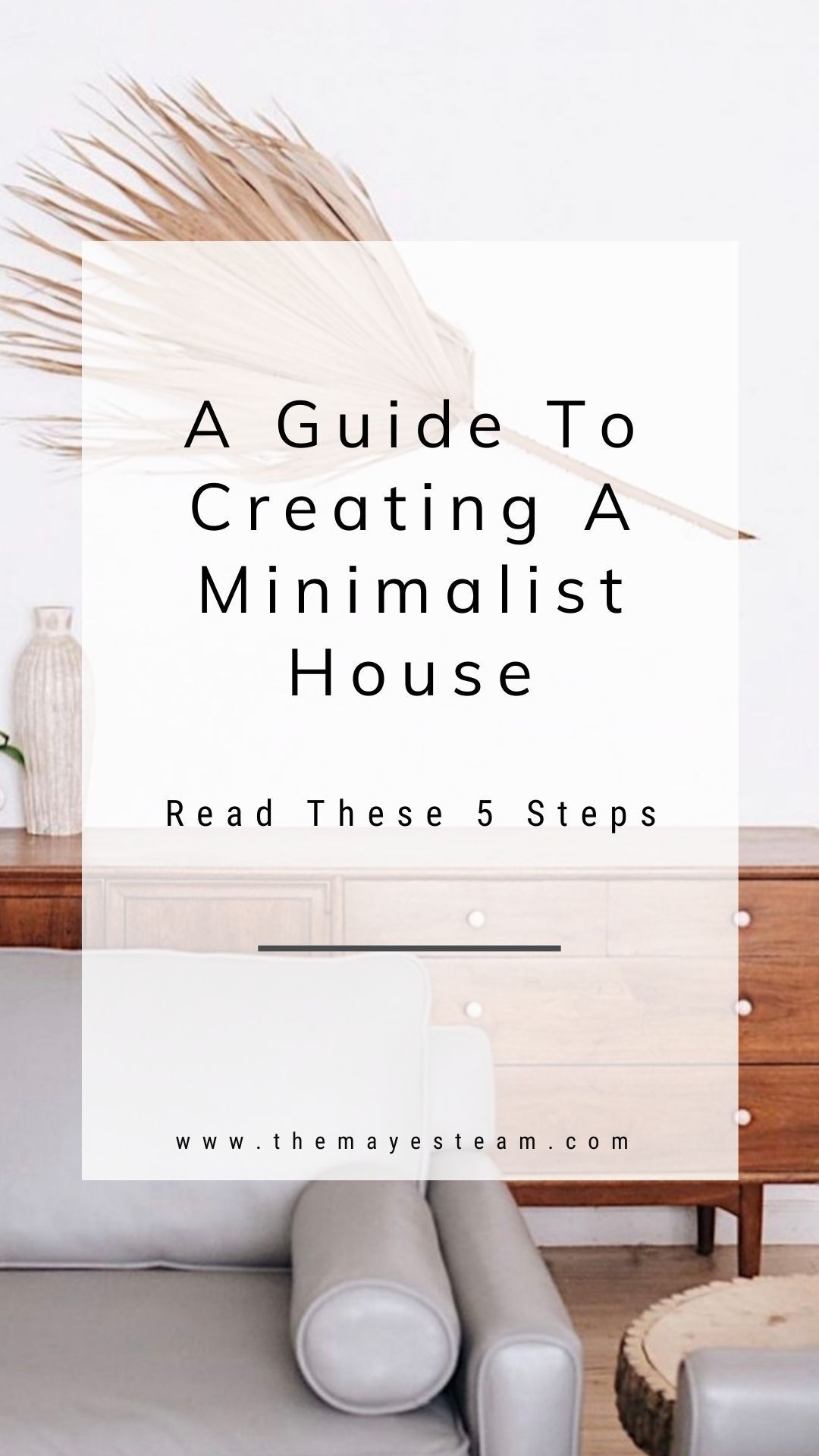 A modern living room in a minimalist home. Image overlaid with text that reads A Guide to Creating a Minimalist House Read These 5 Steps.