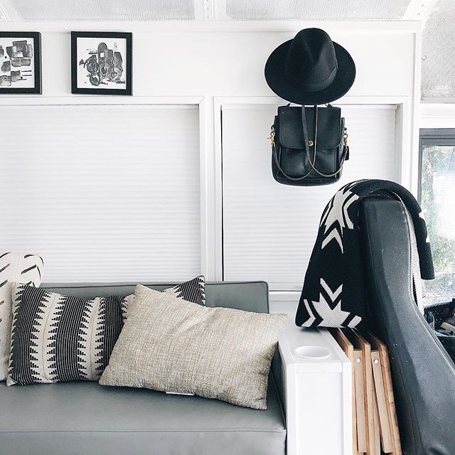 Learn how to make lead magnet landing pages in just ten minutes. Image of living room of skoolie bus with modern deco to inspire learning how to make lead magnet landing pages and opt in pages.