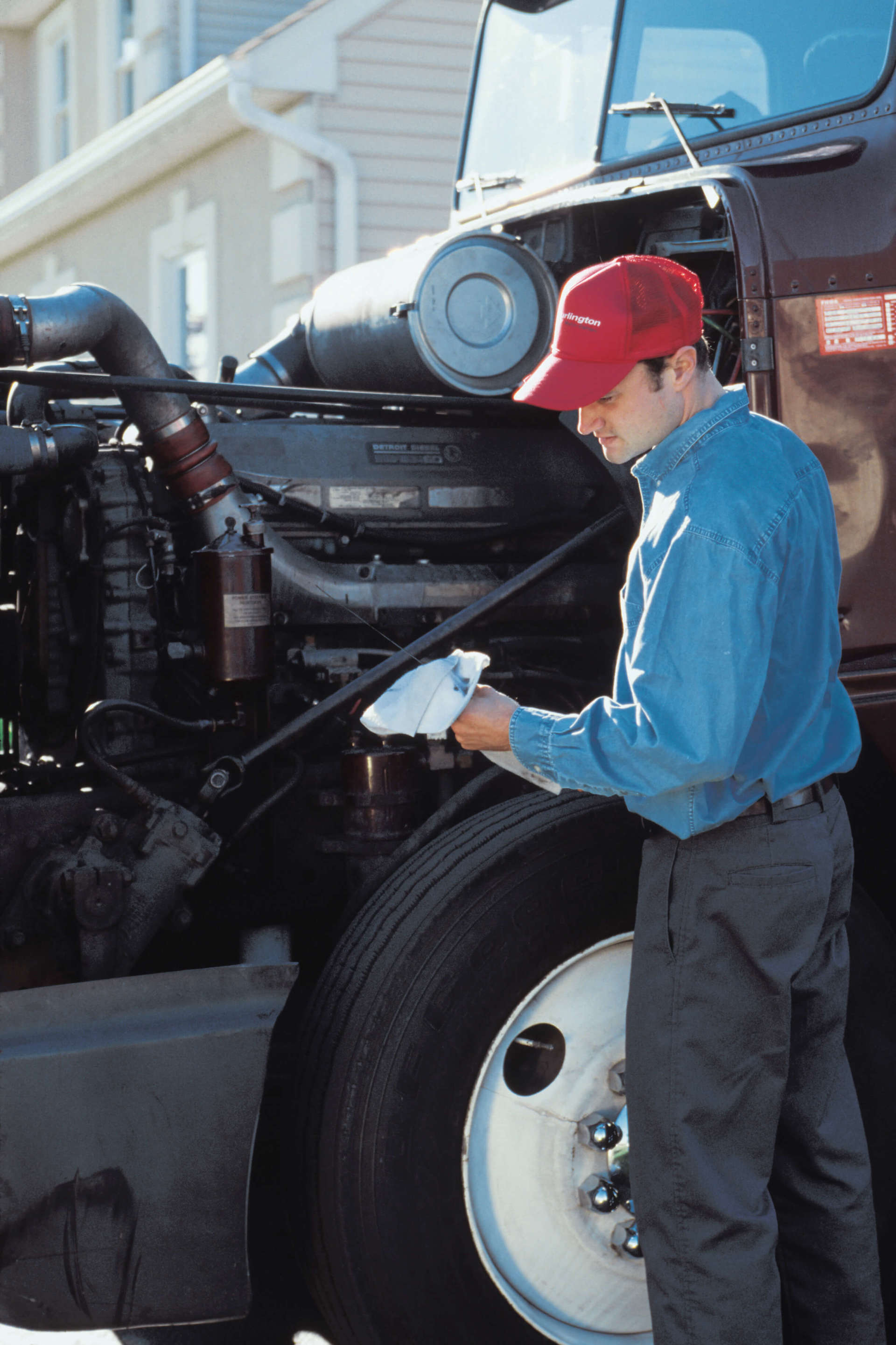 Man servicing engine of semi- Auto Repair in Bay City, TX Man servicing engine of semi- Auto Repair in Bay City, TX