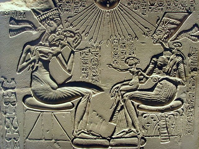 King Akhenaten and his family worshiping the Sun god Aten King Akhenaten and his family worshiping the Sun god Aten