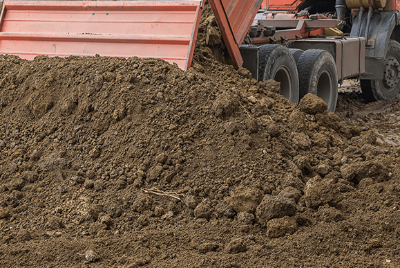 Dump Truck Unloading Top Soil — Newark, OH — Newark Materials, LLC Dump Truck Unloading Top Soil — Newark, OH — Newark Materials, LLC