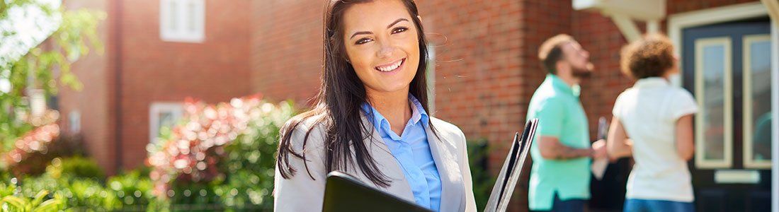 real estate agent showing a home