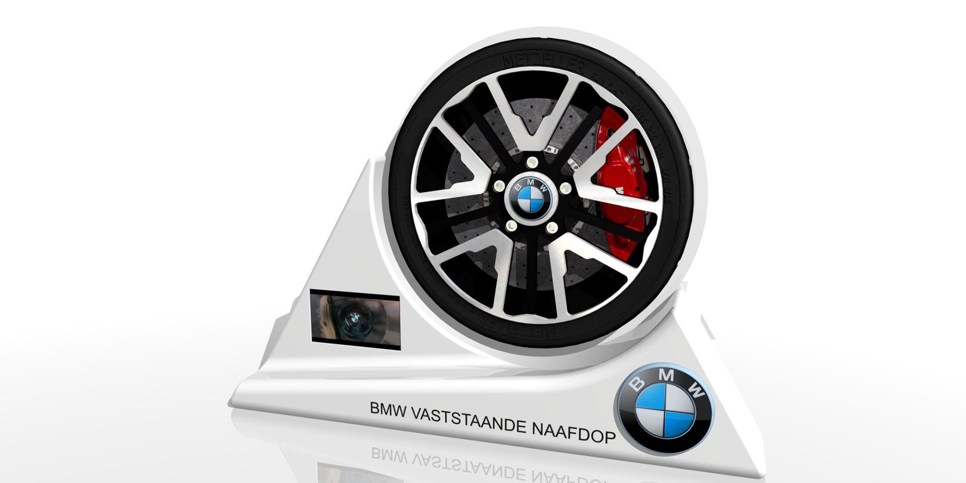 BMW concept car design with a large wheel, white body, and red accents on a display stand