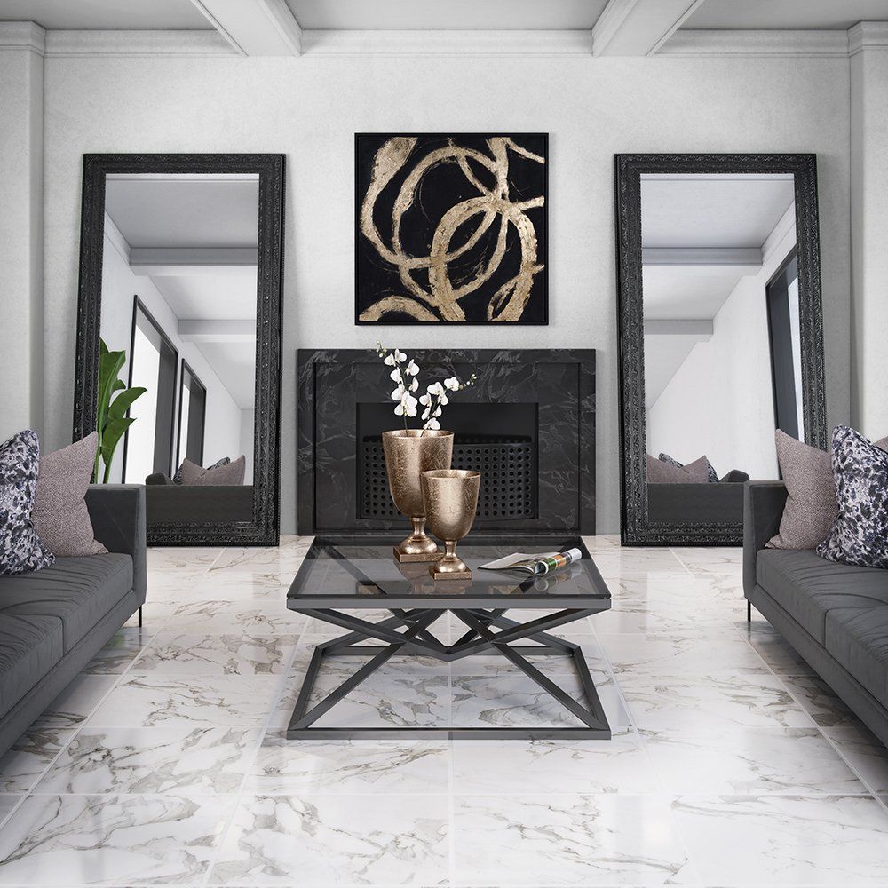 Coffee table in center of room. Home décor on table and on walls