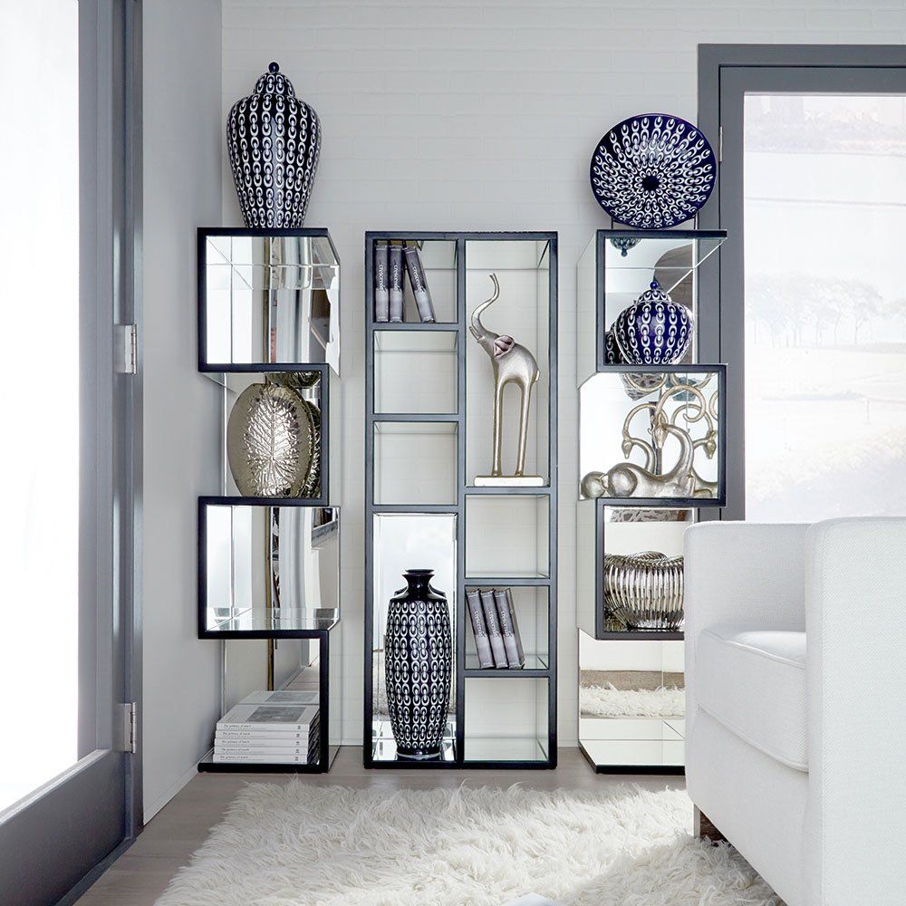 Shelves with vases, books, elephants, and more home décor