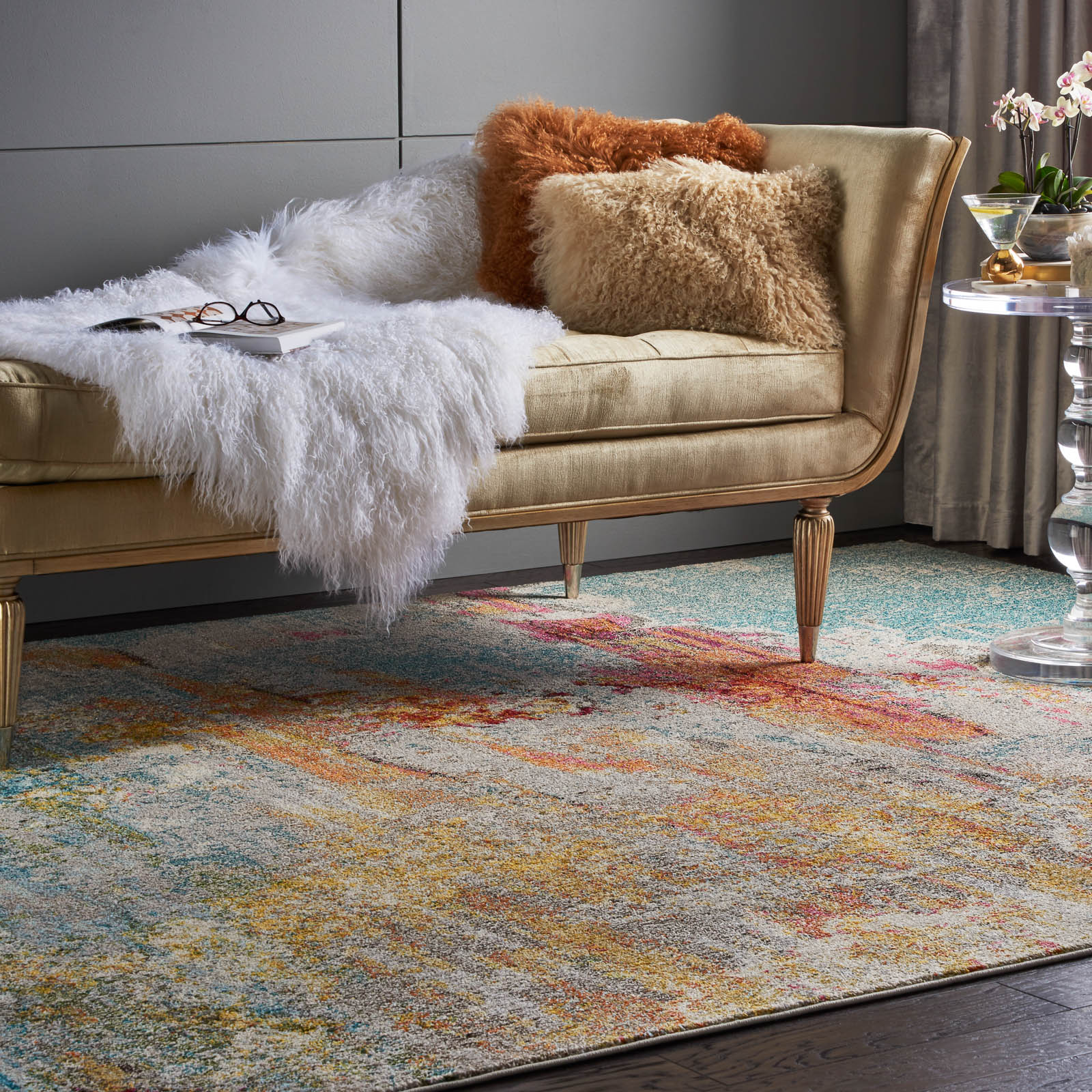 Distressed Area Rug Beneath Upholstered Furniture