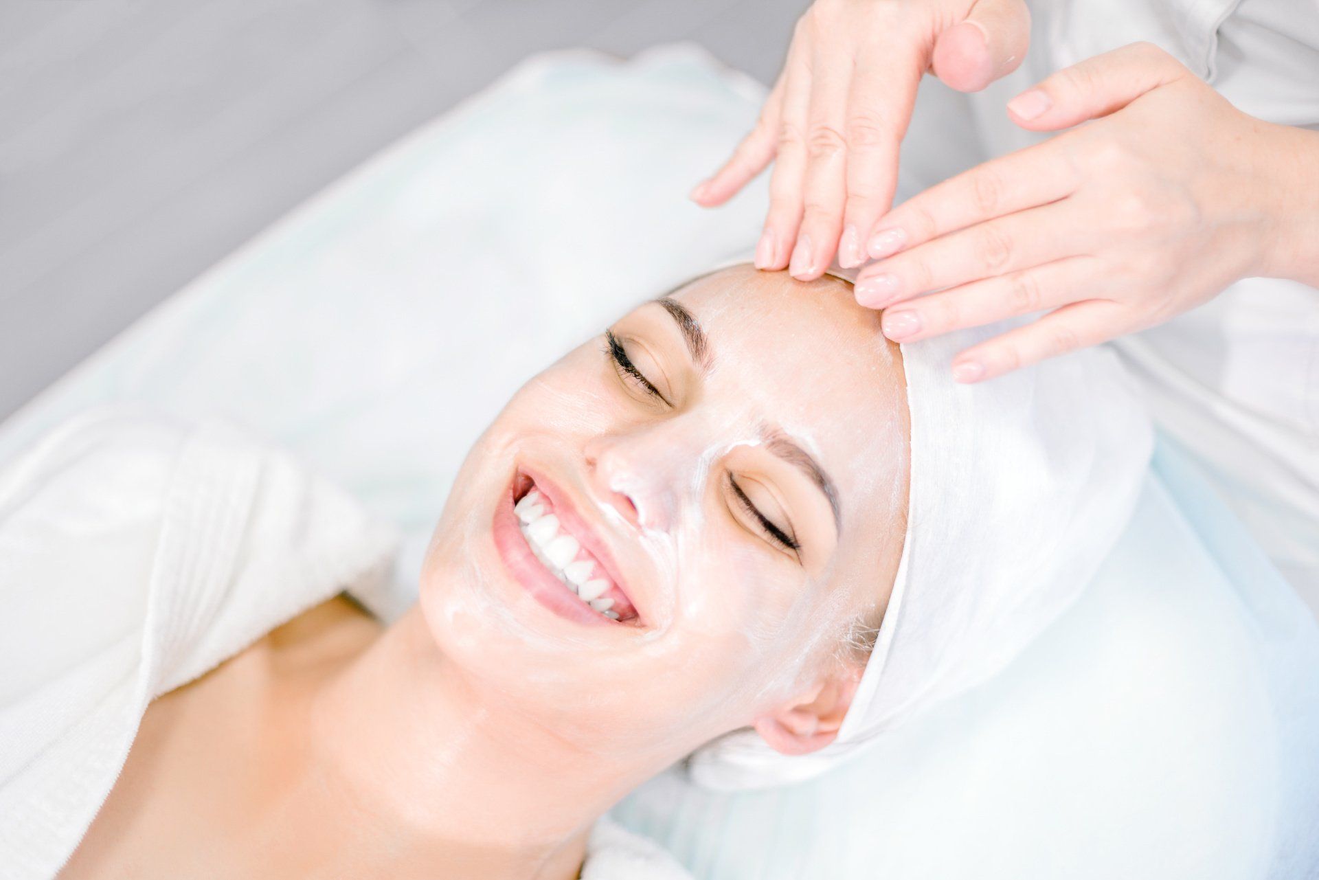 Woman getting facial treatment