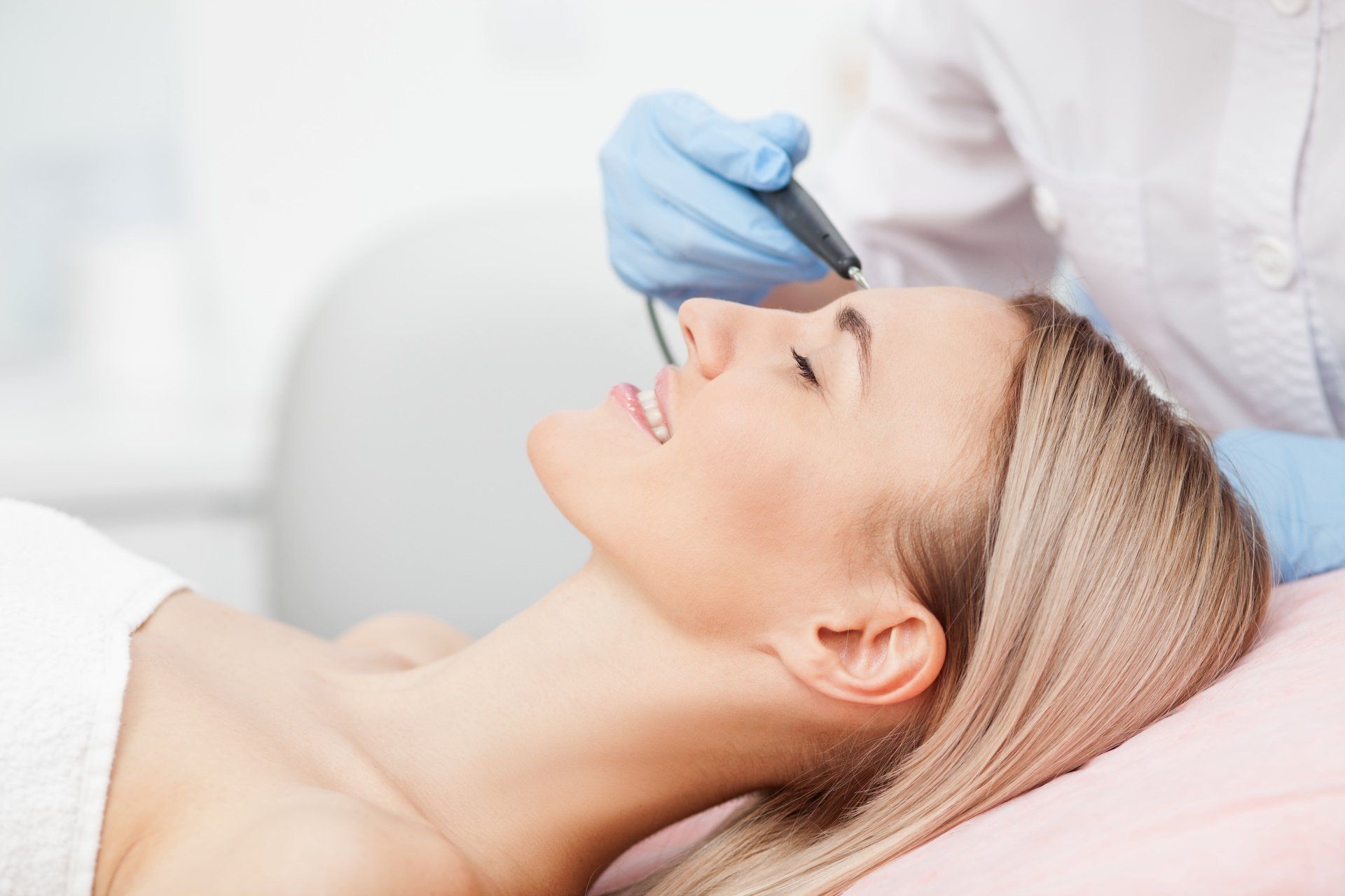 woman getting treatment with medical device