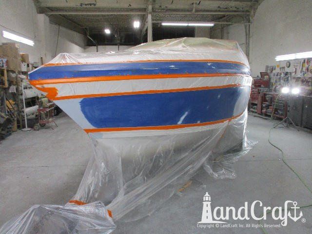 Wellcraft boat in process of exterior refinishing prep work