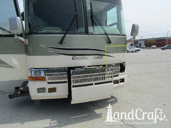Country Coach motor coach with major front end structural damage