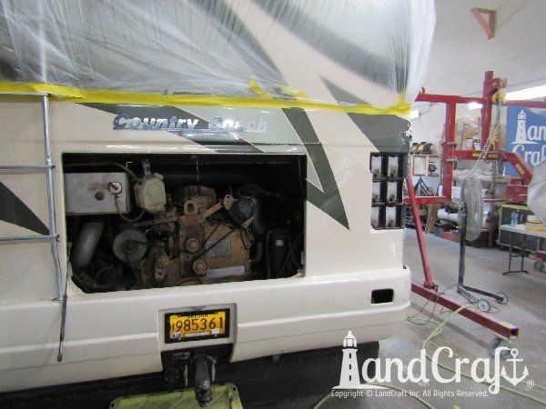 Country Coach motor coach with rear end damage in the repair process