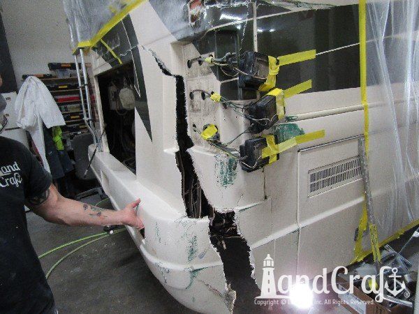 Country Coach motor coach with rear end damage in the repair process