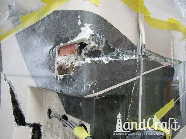 Country Coach motor coach with rear end damage in the repair process