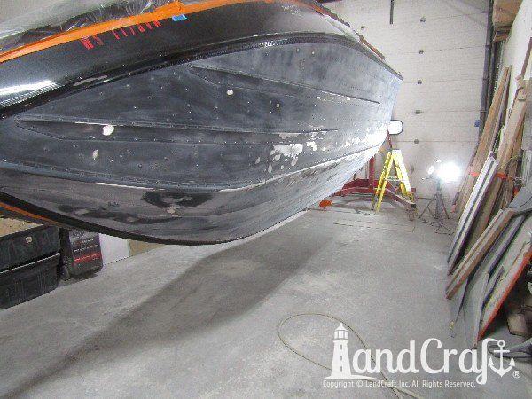 Picture of in process repair of bottom damage on aluminum boat