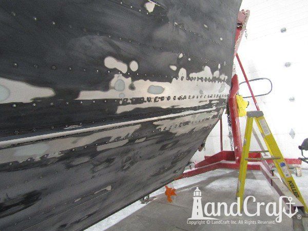 Picture of in process repair of bottom damage on aluminum boat