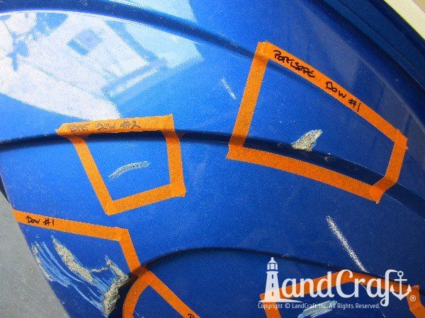 Yamaha waverunner with multiple areas of damage on the bottom hull