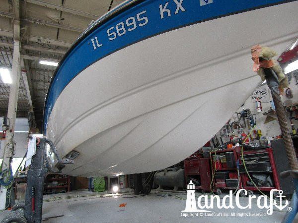 Gelcoat refinishing process near completion on bottom of a Bryant boat