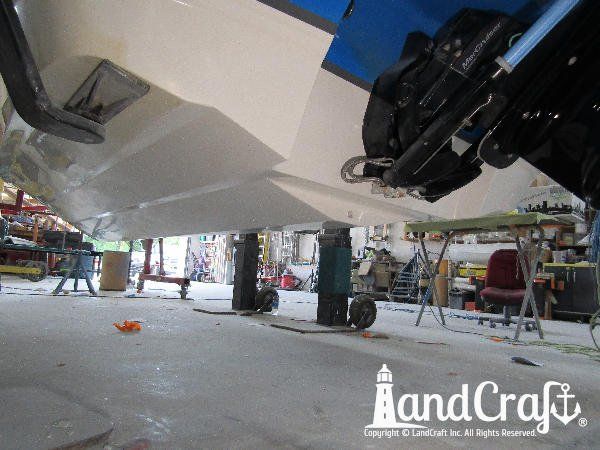 Gelcoat refinishing process near completion on bottom of a Bryant boat