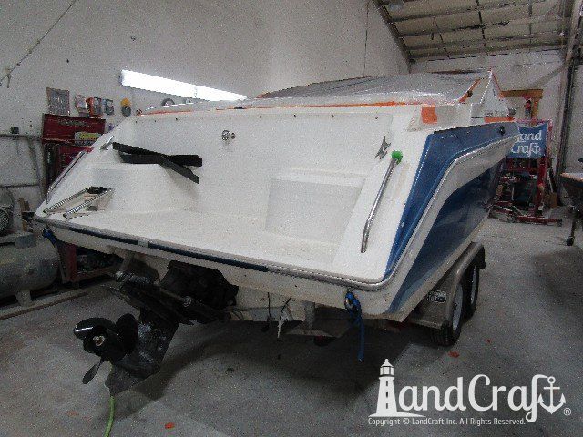 Wellcraft boat before exterior repairs and refinishing