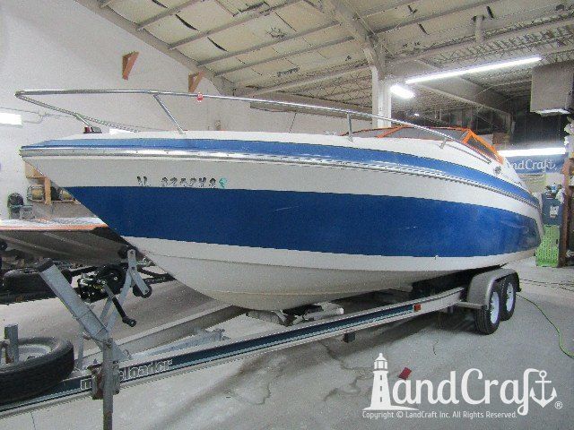 Wellcraft boat before exterior repairs and refinishing
