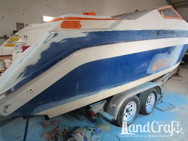 Wellcraft boat in process of exterior fiberglass and gelcoat repair