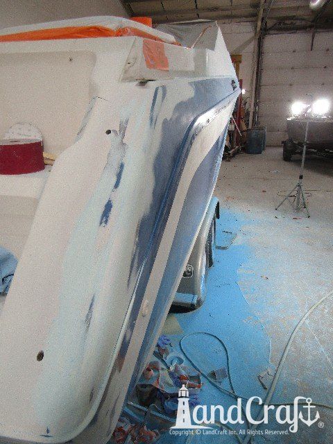 Wellcraft boat in process of exterior fiberglass and gelcoat repair