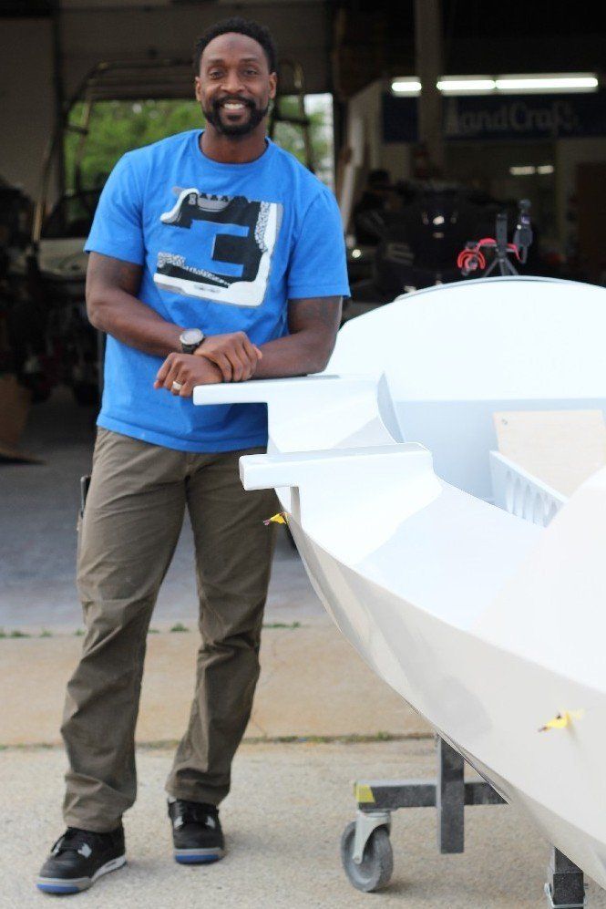Charles Tillman with the Row4Kids boat at LandCraft