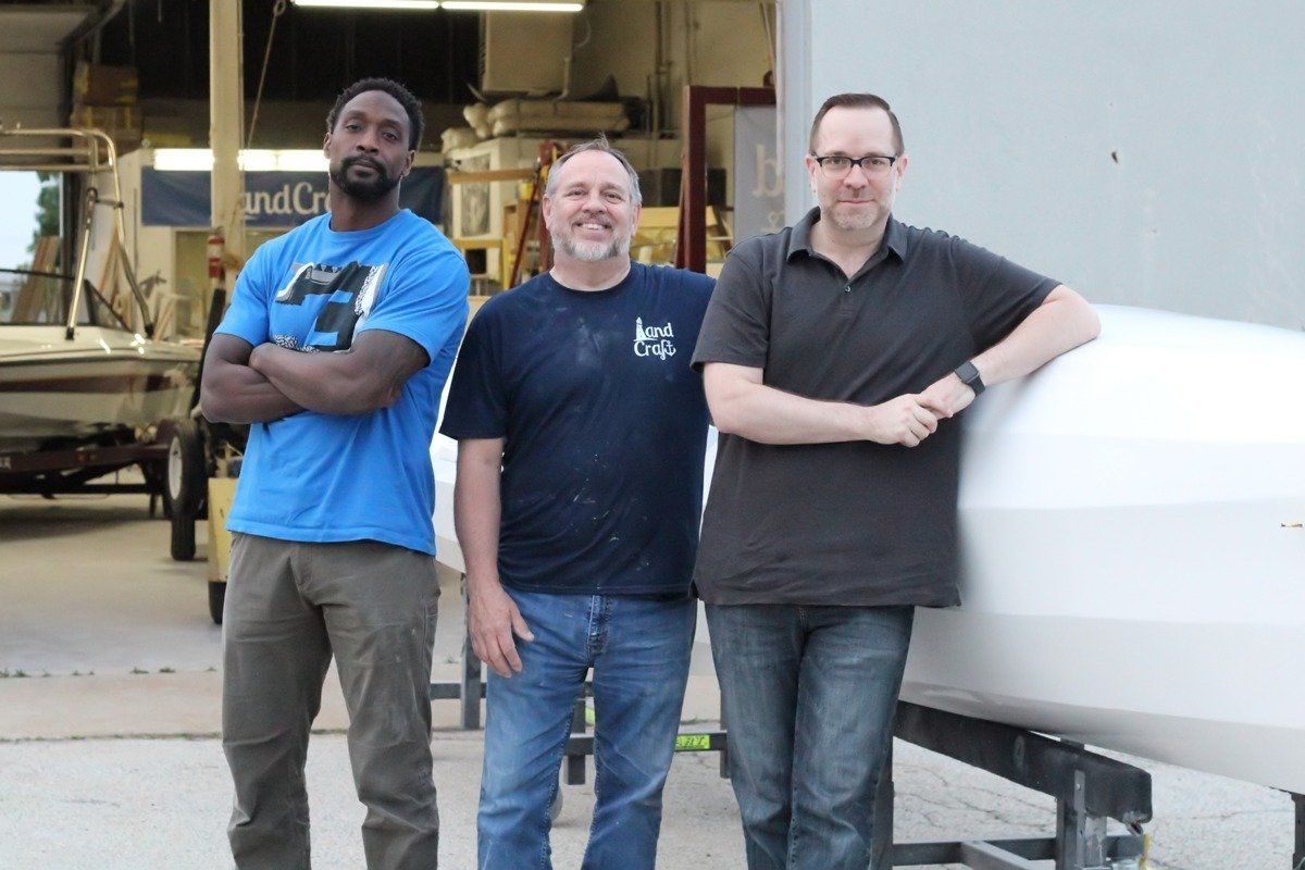 Charles Tillman with Keith Lekberg and the Row4Kids boat at LandCraft