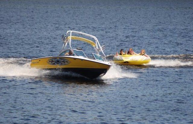 Boat pulling a tube in the water