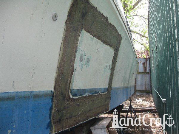 Commercial vessel with hull side in the repair process