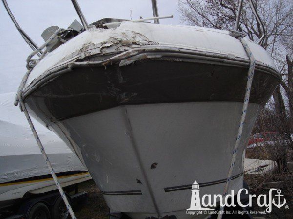 Boat with fiberglass structural damage at the bow