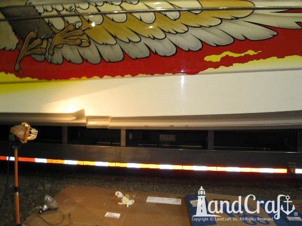 High performance catamaran boat getting an emergency gelcoat repair