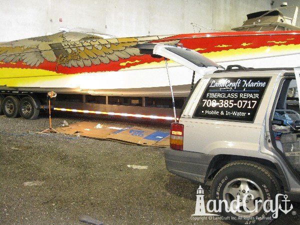 High performance catamaran boat getting an emergency gelcoat repair