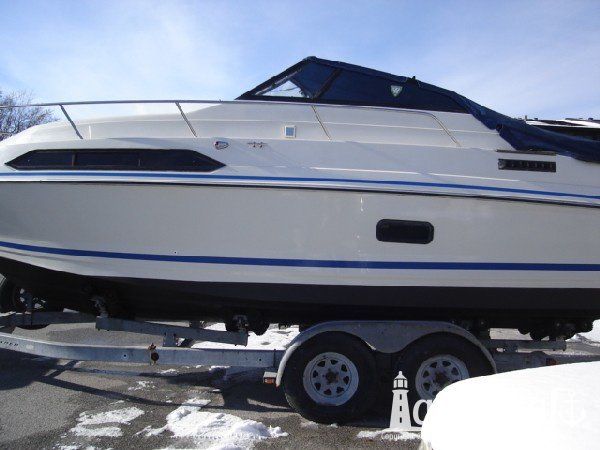 Boat with refurbished and glossy gelcoat and updated decal striping