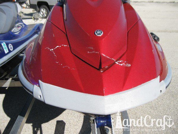 Red Yamaha with damage across the front end