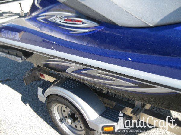 Blue Yamaha with scratches along the side gunnel