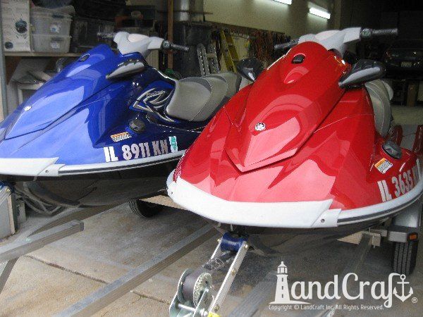 Red and Blue Yamaha waverunners completely repaired and refinished
